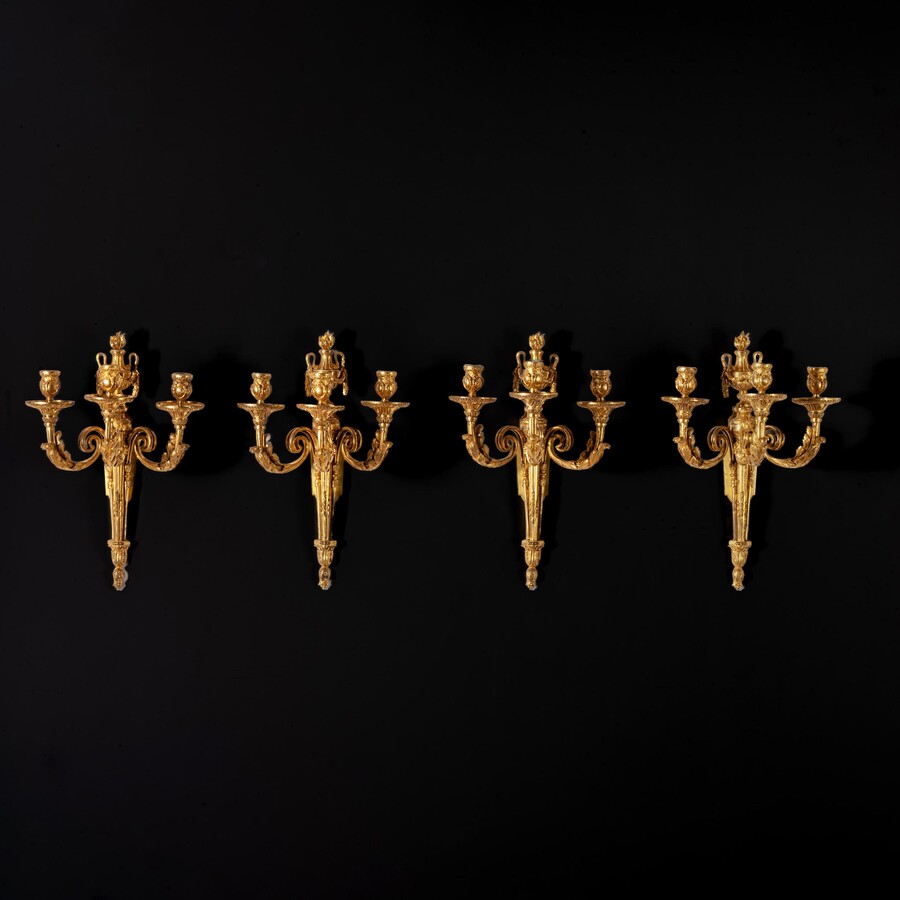An Highly Important Set of Four Louis XV Ormolu Three-branch Wall-lights Circa 1770.